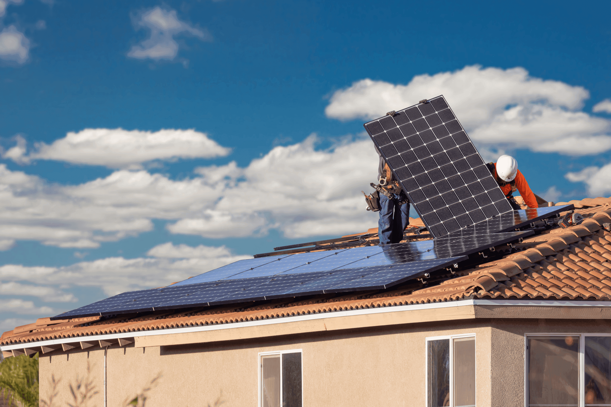 A bright rooftop with solar panels under a sunny sky